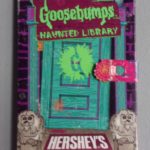 Cover of Goosebumps Haunted Library, door and Hershey's welcome mat with title information