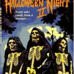 cover of Halloween Night II by R L Stine, has three figures dressed in skeleton outfits and black cloaks in front of a Halloween night background